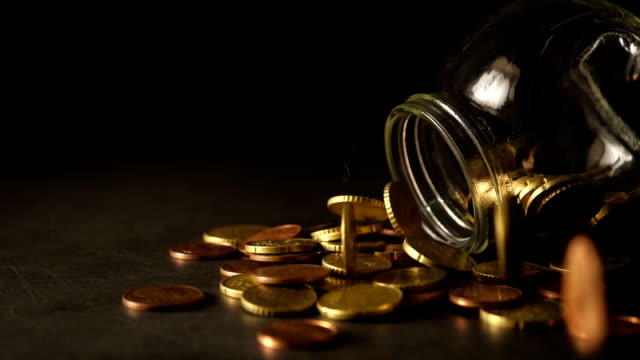 Drop-gold-coins-in-the-form-of-Slow-Motion-Concept
