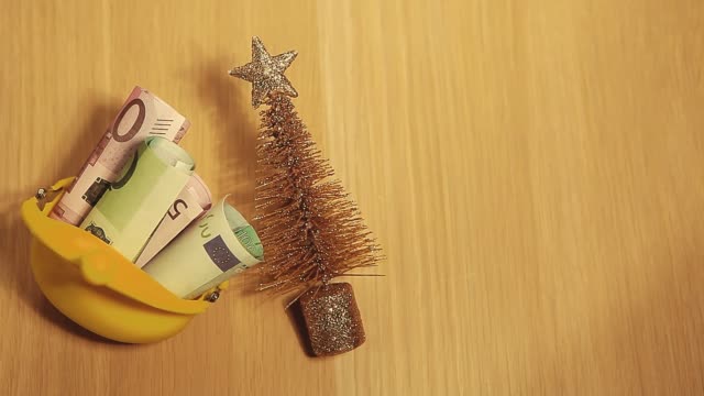 gold-fir-tree-purse-money-table-hd-footage