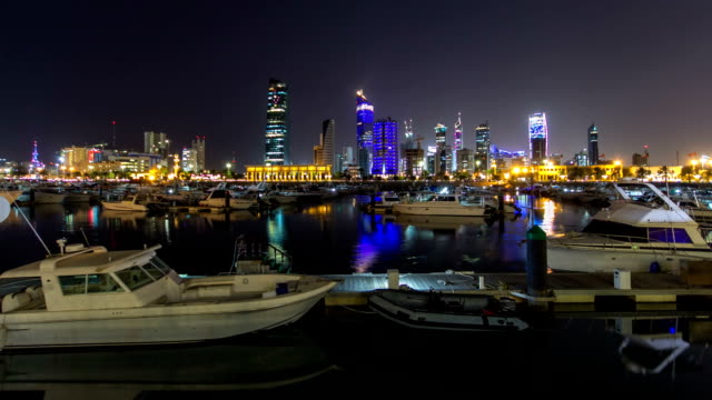 Yachts-and-boats-at-the-Sharq-Marina-night-timelapse-hyperlapse-in-Kuwait.-Kuwait-City,-Middle-East
