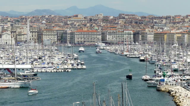 Yachts-and-boats-in-harbor-of-Marseille,-historic-landmark,-tourism-sightseeing