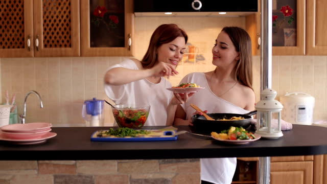 Two-girls-prepare-Breakfast-at-home-in-the-morning