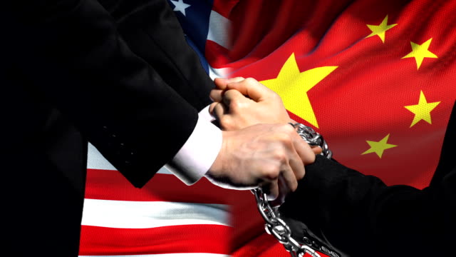 United-States-sanctions-China,-chained-arms,-political-or-economic-conflict