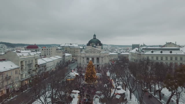 Lviv,-Ukraine.-Arial-shot.-Opera-house.-Christmas-tree.-Christmas-Fair.-People-are-walking-around-the-city-center.-Winter