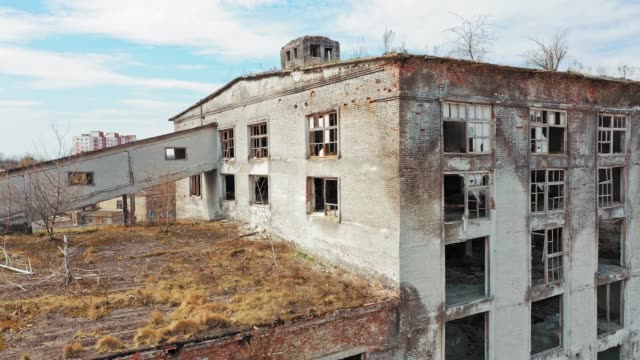 Aerial-view-of-an-old-factory-ruin-and-broken-windows.