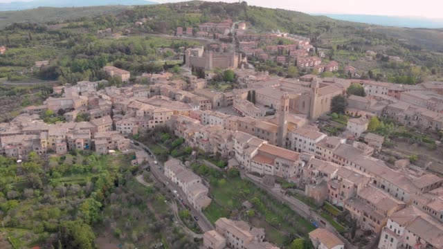 amazing-italian-town-Montalcino-in-mountains-in-summer-day,-aerial-view,-picturesque-old-living-houses