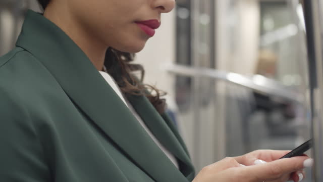 Woman-Using-Cellphone-in-Public-Transport