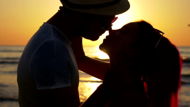 Beautiful-couple-touching-and-kissing-at-twilight
