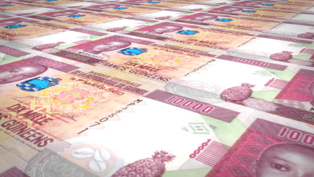 Billetes-de-10-mil-francos-guineanos,-balanceo,-dinero-en-efectivo,-lazo