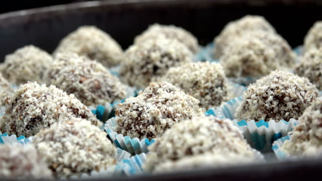 Chocolate-coconut-candy-balls,-closeup-dolly-shot-background