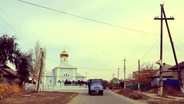 Village-street-view-with-church-and-truck