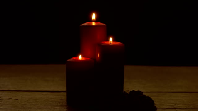 Three-red-candles-lights-with-rose