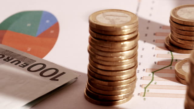 Münzen,-Charts-und-finanzielle-Diagramme