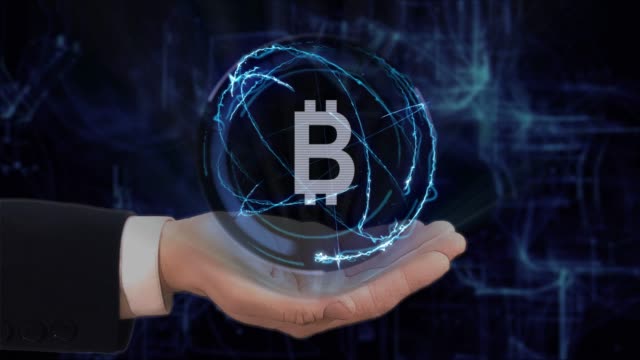 Painted-hand-shows-concept-hologram-Sign-BTC-on-his-hand