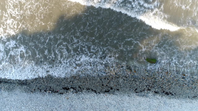 Aerial-photography,-seashore,-rocky-beach,-dark-ocean-waves.