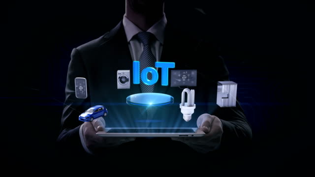 Businessman-lifting-smart-pad,-IoT-technology-connecting-mobile,-car,-energy-saving,-washer,-refrigerator,-smart-home-devices,-Internet-of-things.-4k-movie.