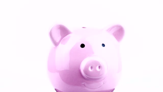 Rotation-of-pink-pig-piggy-bank-on-white-background.-4k-Resolution
