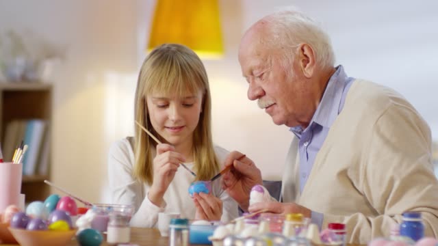 Portrait-of-Grandfather-and-Granddaughter-Preparing-for-Easter