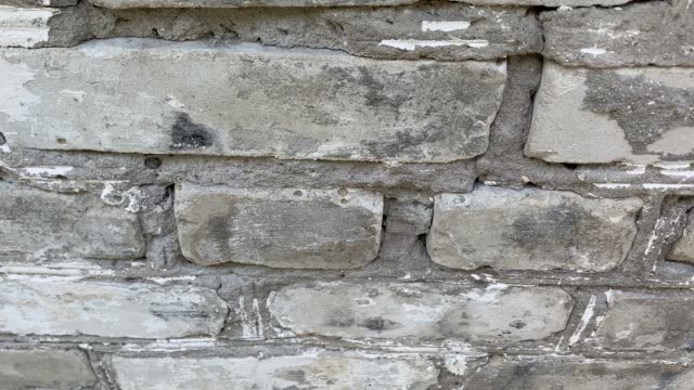 White-brick-wall-on-camera-in-downward-motion