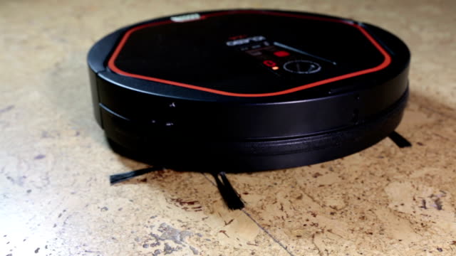 the-robot-the-vacuum-cleaner-cleans-a-floor