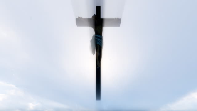 Jesus-cross-against-blue-sky,-4K