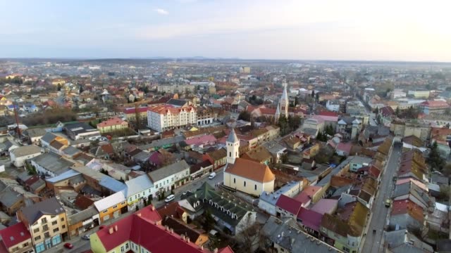 Aerial-footage-of-Mukachevo-city-center---top-view-at-sunset-time