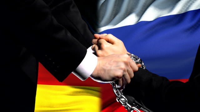 Germany-sanctions-Russia,-chained-arms,-political-or-economic-conflict,-ban