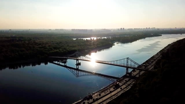 Kiev-(Kiyv)-Ukraine-capital.-River-Dnepr-(Dnipro)-Parkivyi-Bridge-to-Truhaviv-island-Aerial-drone-video-footage-from-above.-Sunrise-time