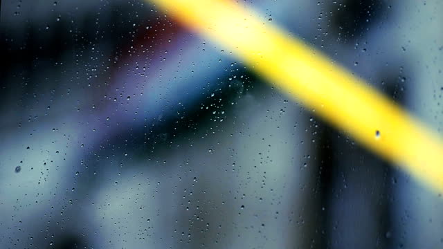 View-of-hungarian-flag-through-rain-drops-on-window