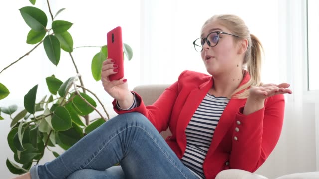 Woman-talking-on-phone-via-video-chat