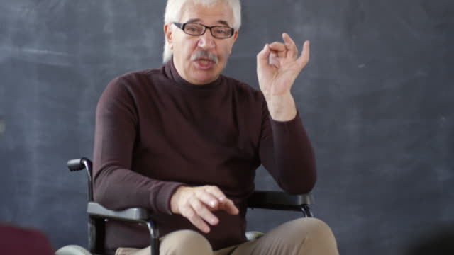 Disabled-Professor-Discussing-Topic-with-Students
