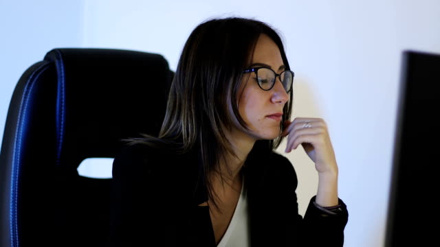 Business-woman-in-glasses-works-at-the-computer-at- the-office.