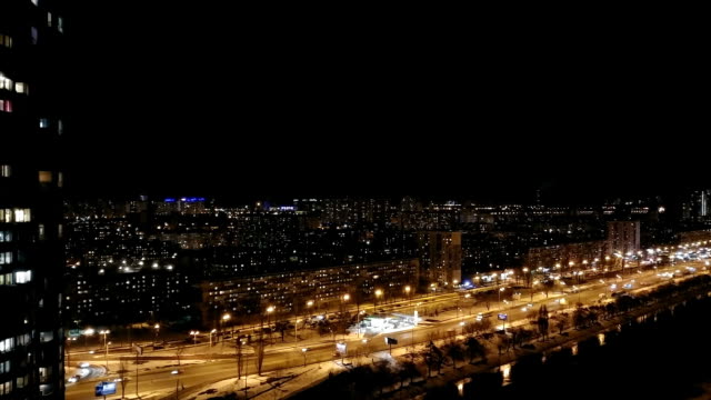 The-beautiful-view-on-the-night-city-with-a-traffic.-time-lapse