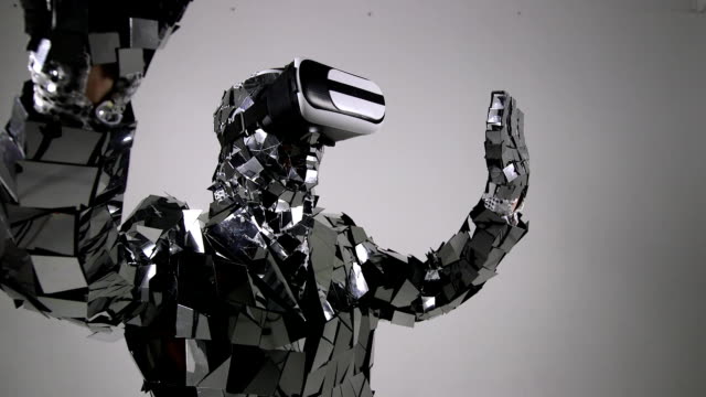 Futuristic-Robot-in-mirror-costume-vorking-with-virtual-interface,-touching-interface-by-index-finger.