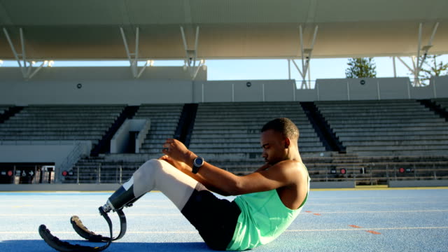 Disabled-athletic-exercising-on-a-running-track-4k