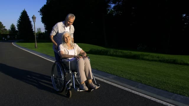 Real-love-of-senior-couple-with-paralyzed-wife-in-park