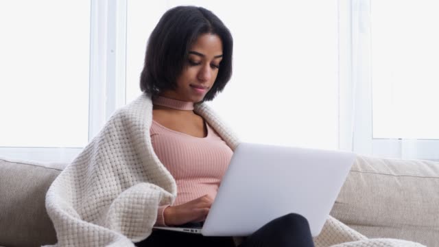Teenage-girl-working-on-laptop