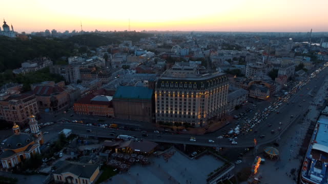Square-near-the-river-station-in-the-old-town-at-sunset-aerial
