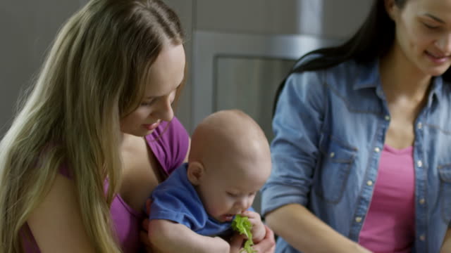 Female-Couple-with-Children-Making-Salad