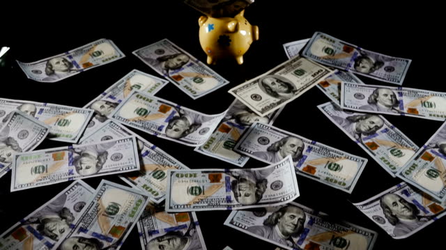 piggy-bank.-Piggy-bank-and-one-hundred-dollar-bills