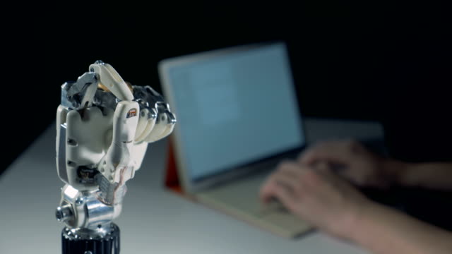 Fingers-of-a-robotic-arm-are-doing-an-okay-gesture