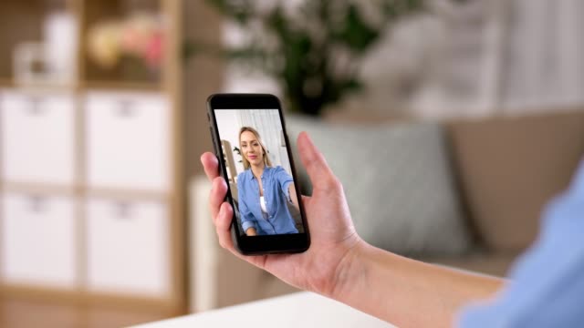woman-having-video-call-on-smartphone-at-home
