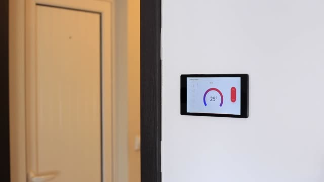 Smart-home-climate-control-device-on-a-wall