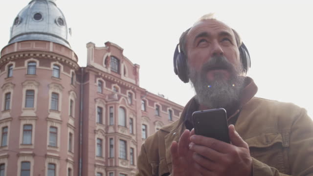 Old-Man-Listening-to-Music-while-Walking