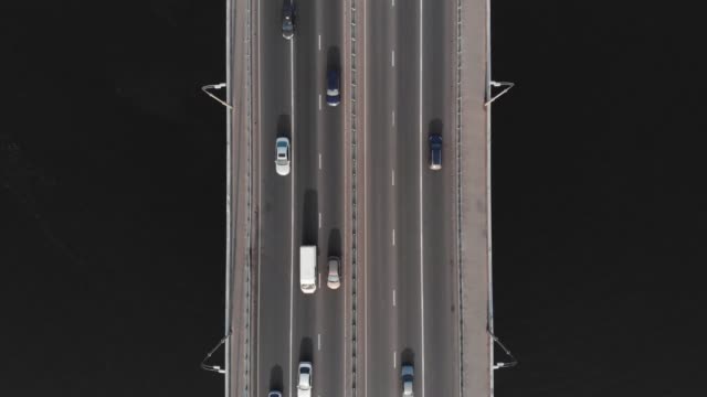 Highway-bridge-traffic-aerial-top-view-high-speed-time-lapse-cars