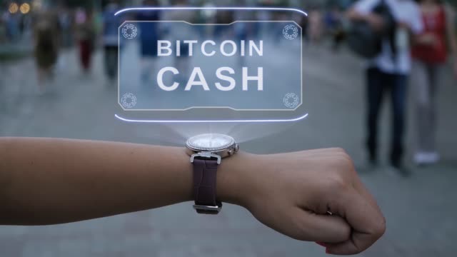 Female-hand-with-hologram-Bitcoin-cash