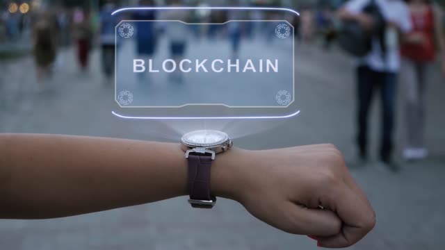 Weibliche-Hand-mit-Hologramm-Blockchain