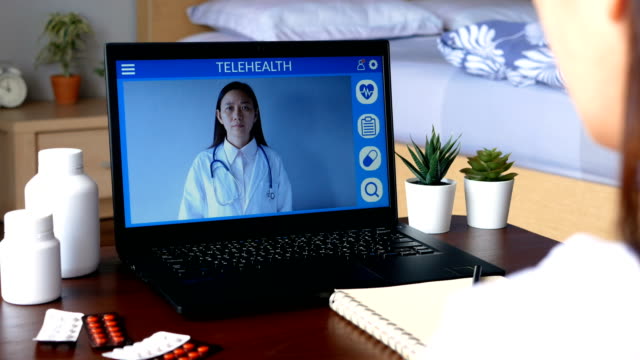 deaf-mute-patient-use-remote-distance-video-conference,-make-online-consultation-by-sign-language-with-doctor-on-laptop-about-illness,-medicine-via-vdo-call.-Telehealth,-Telemedicine,-online-hospital