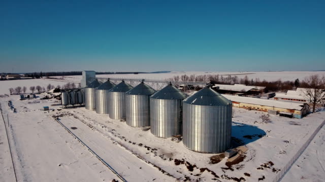 Agriculture-grain-silos-storage-tank.-Large-metal-silos-elevator-and-factory