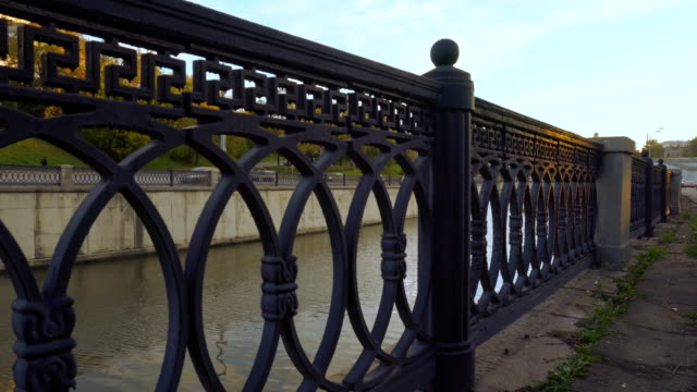 panoramic-view-of-the-embankment-of-the-city-river-and-cast-iron-fence