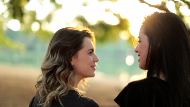 LGBT-female-couple-together-at-the-park-during-sunset-golden-hour-time